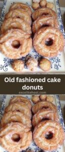 Old fashioned cake donuts with a shiny glaze on a cooling rack